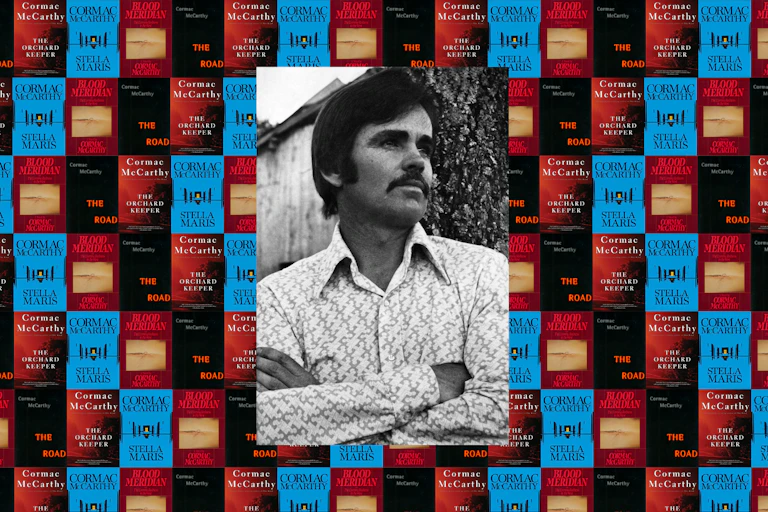 A portrait of a man on a background of books