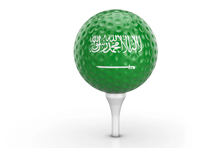 Green golf ball with white Arabic lettering and sword.