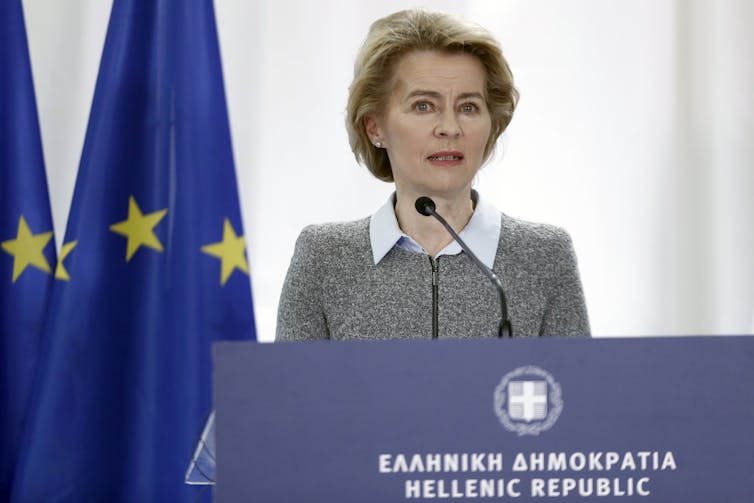 Ursula von der Leyen standing at a podium that reads Hellenic Republic.