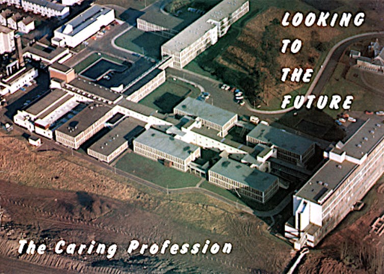 Aerial view of hospital complex on front of postcard with text