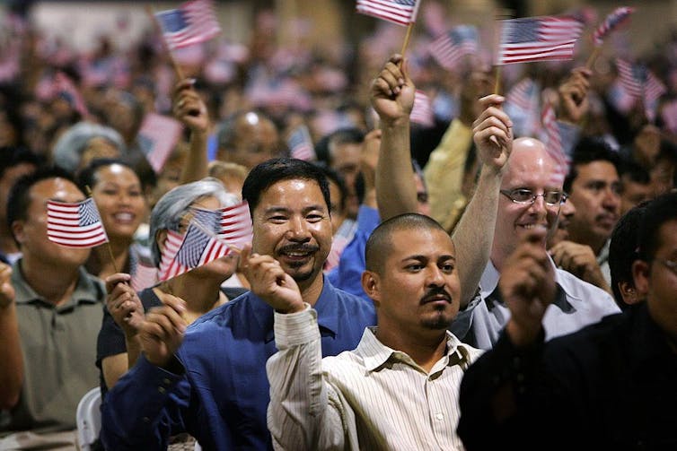 People waving U.S. flags.