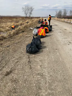 First Nations community members in the midst of the Spring clean-up