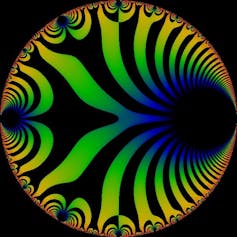 A circle containing curving black stripes against other colors, mostly yellow, green, and blue.