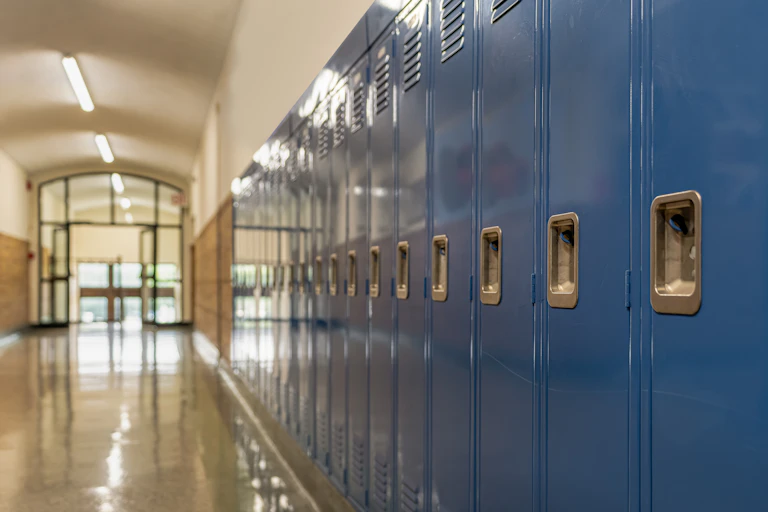 A hallway of lockers seen.