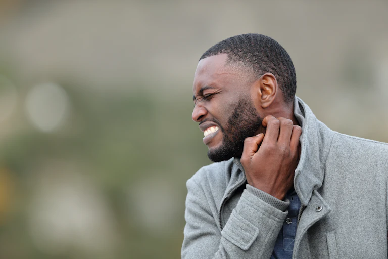 Man scratching his neck