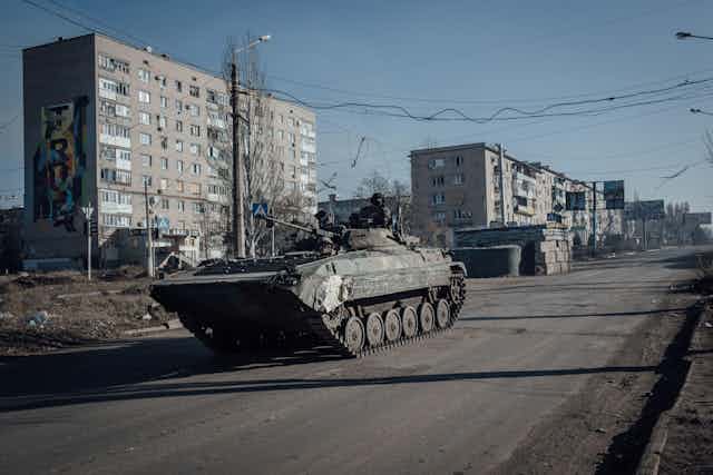 A tank rolls through the city of Bakhmut.