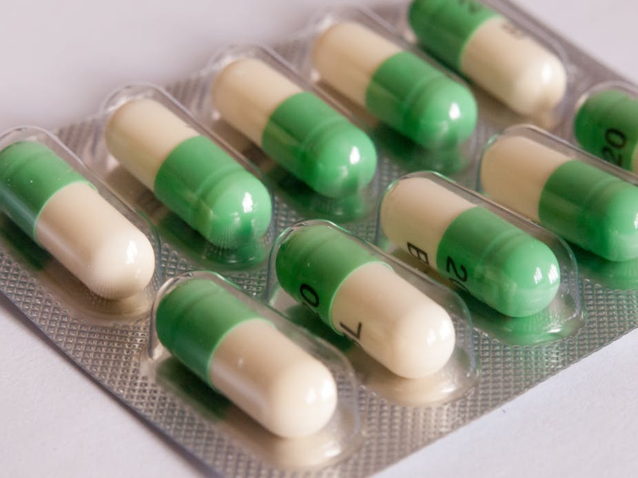 A blister pack of white and green antidepressant tablets.