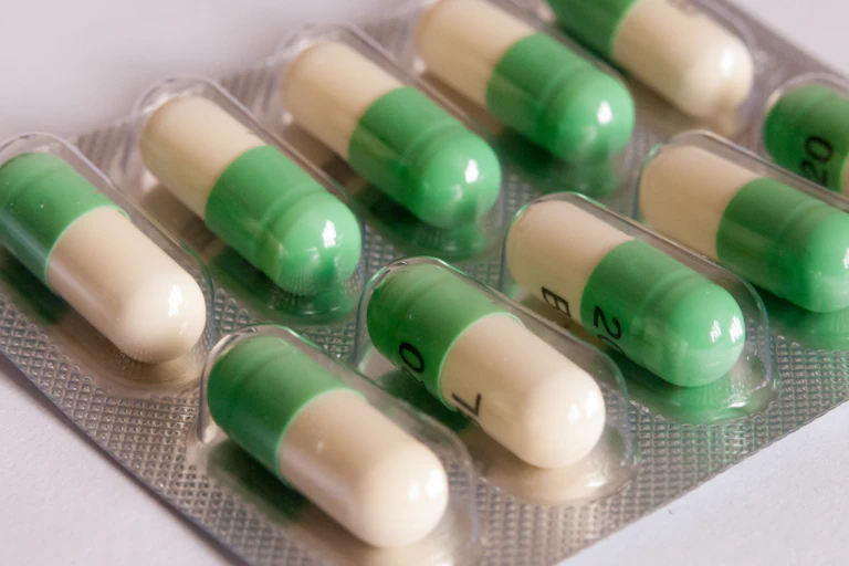 A blister pack of white and green antidepressant tablets.