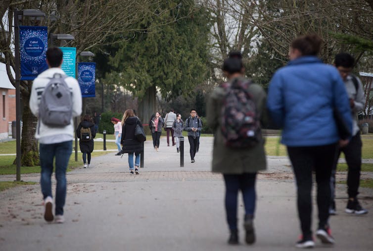 Students seen walking on a campus.
