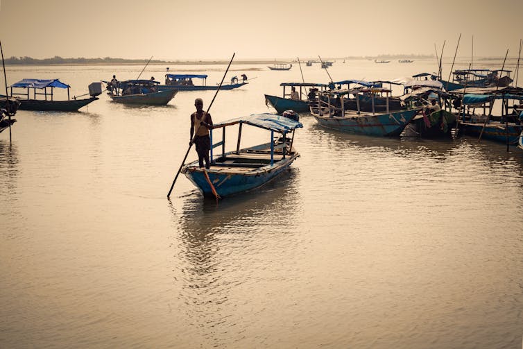 small boats at sunset on a lake