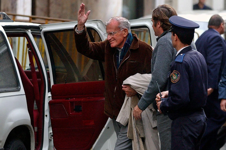 Former Uruguay president Juan María Bordaberry getting into a car.