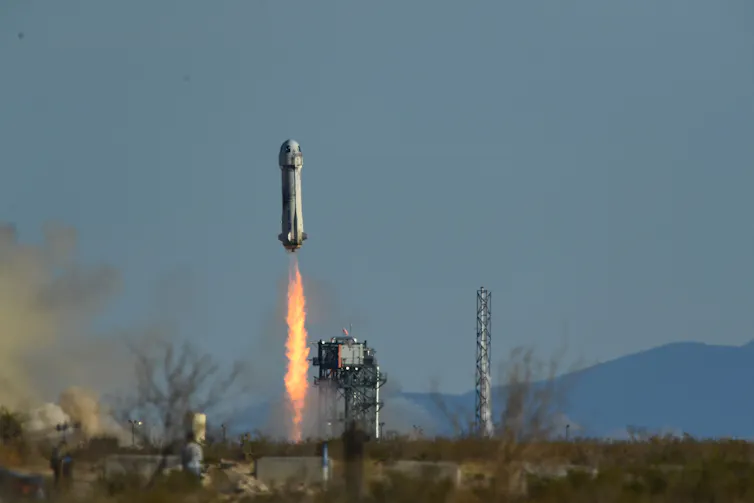 A rocket launching from the desert.