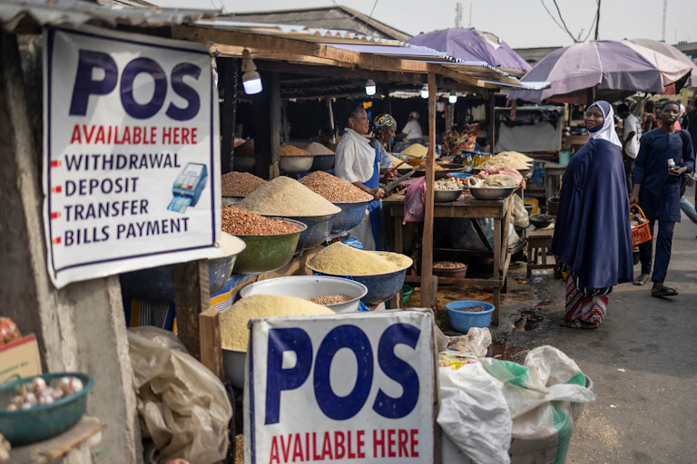 Signs advertising point of sale operations in a market