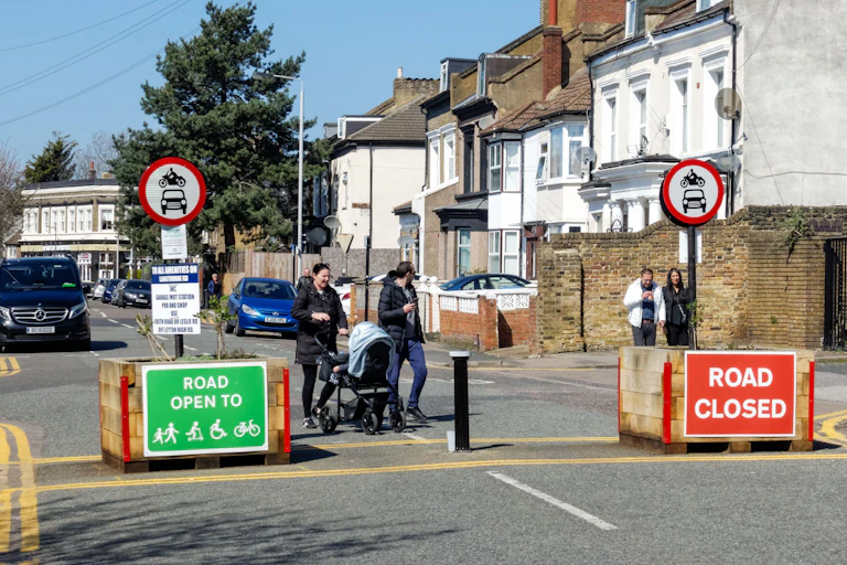 Pedestrians entering a low-traffic neighbourhood.
