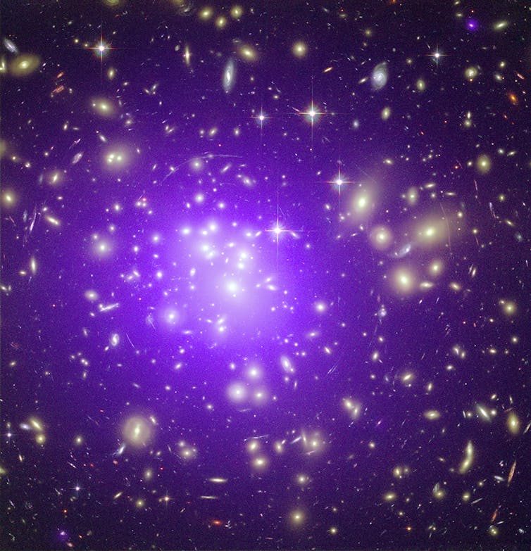 Gravitational lensing in the galaxy cluster Abell 1689.