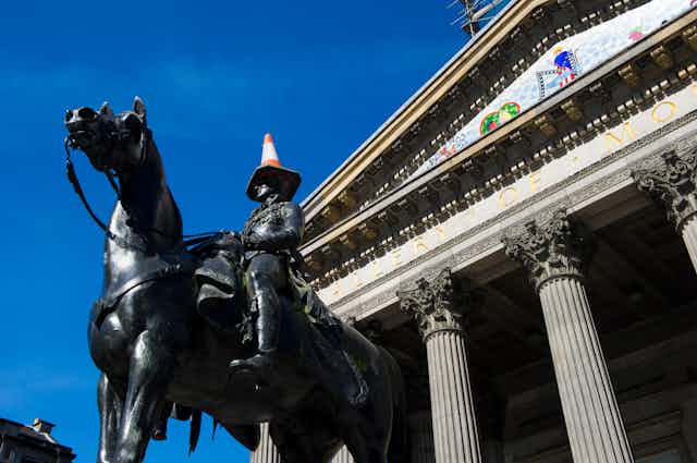The statue of the Duke of Wellington outside Glasgow's Gallery of Modern Art, with a traffic cone on his head