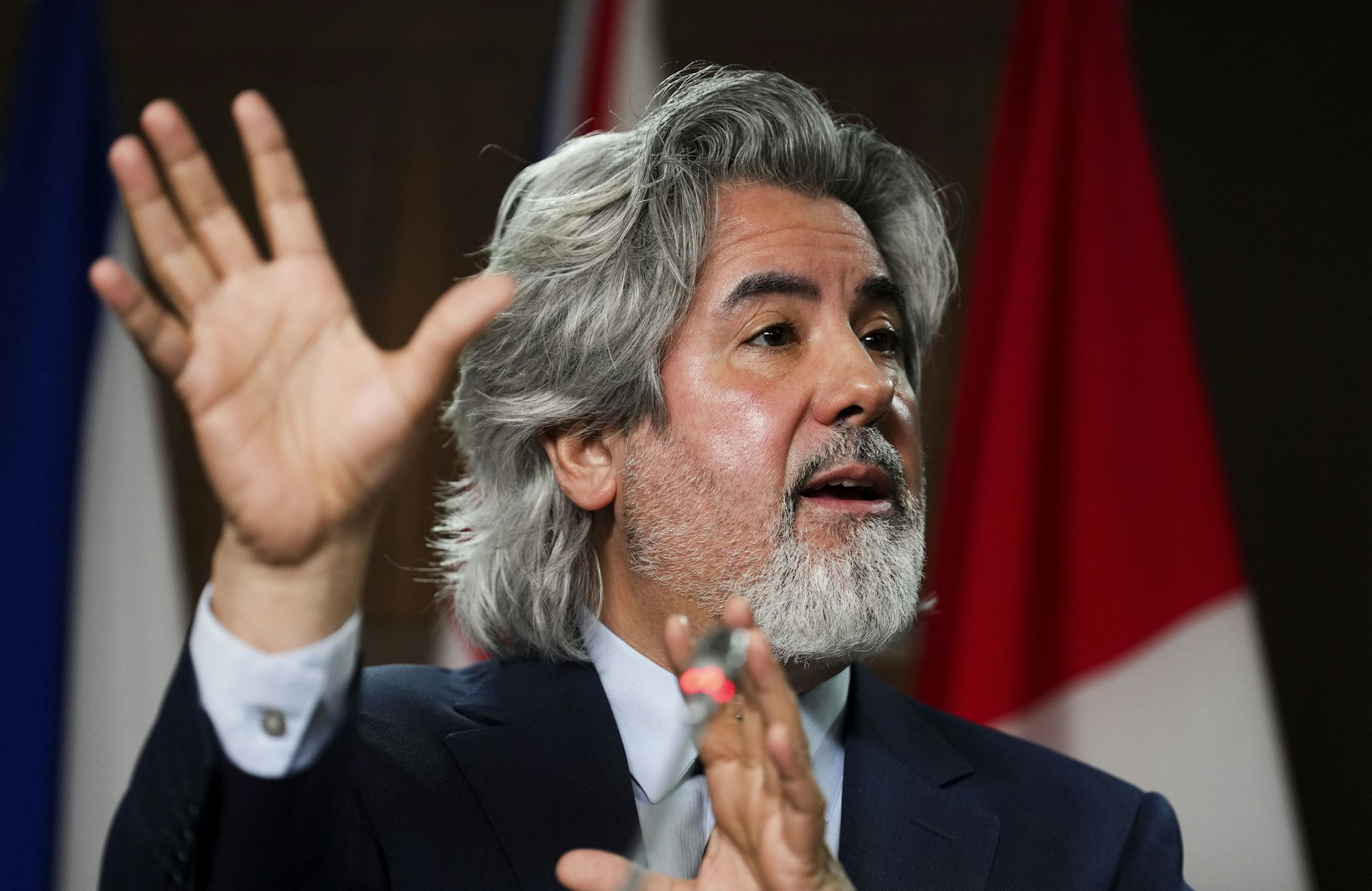 Pablo Rodriguez uses his hands to discuss the Online News Act during a news conference in 2022.