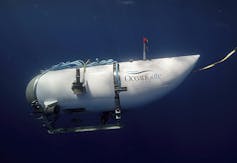 A teardrop-shaped submersible is seen underwater.