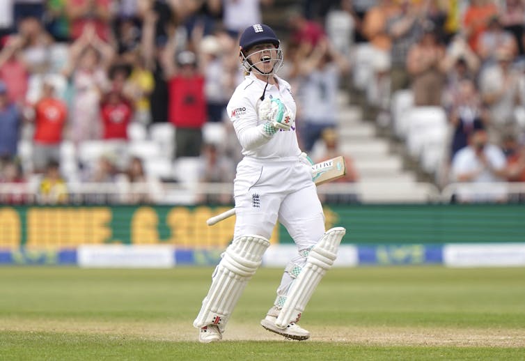 A cricketer celebrating.