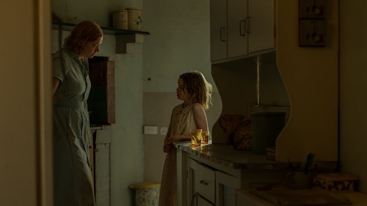 Mother and daughter in a kitchen.