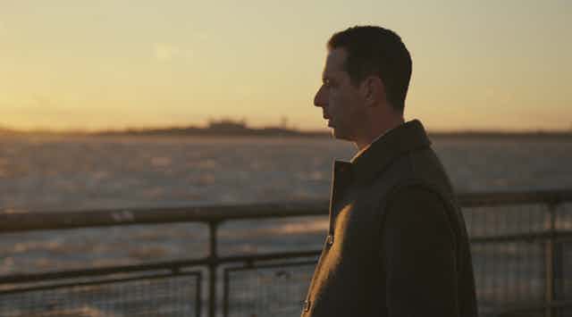Kendall Roy (Jeremy Strong) gazing into the sunset in the final episode of Succession.