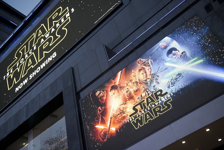 A poster for Star Wars: The Force Awakens outside a cinema.