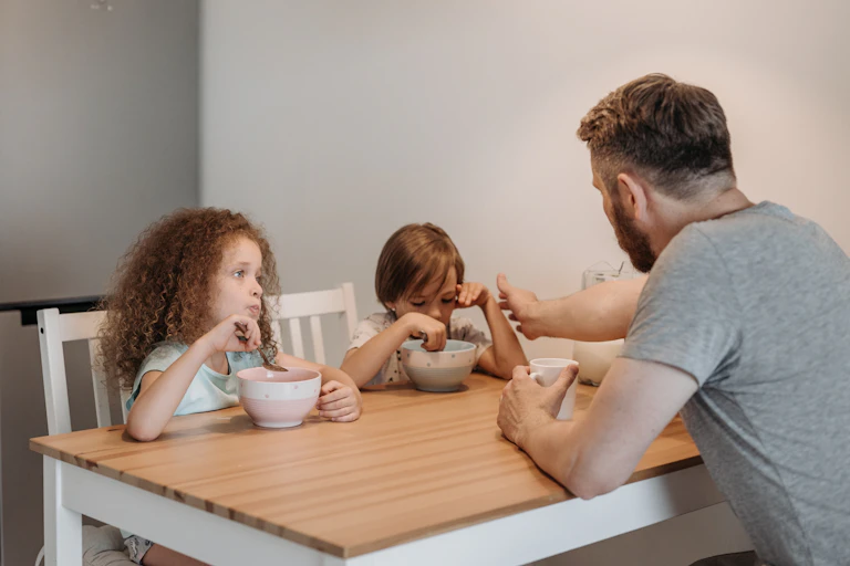 A father talks to his two children.