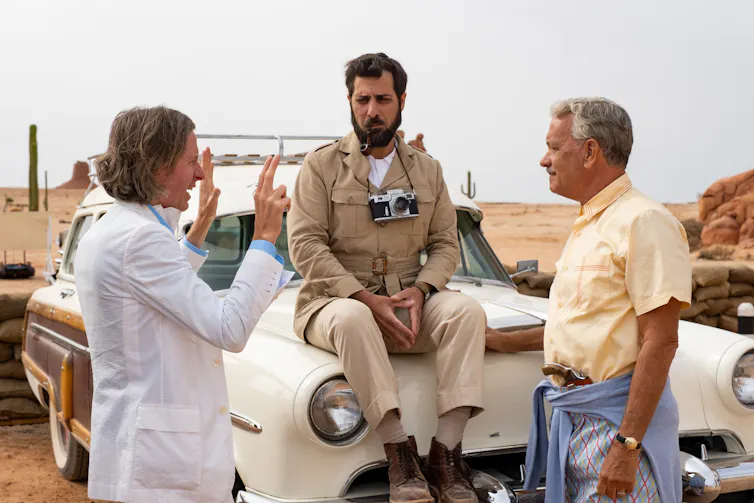 Two actors are directed by a director.
