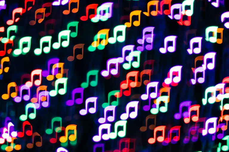 Musical notes are shown in different colors on a black background.