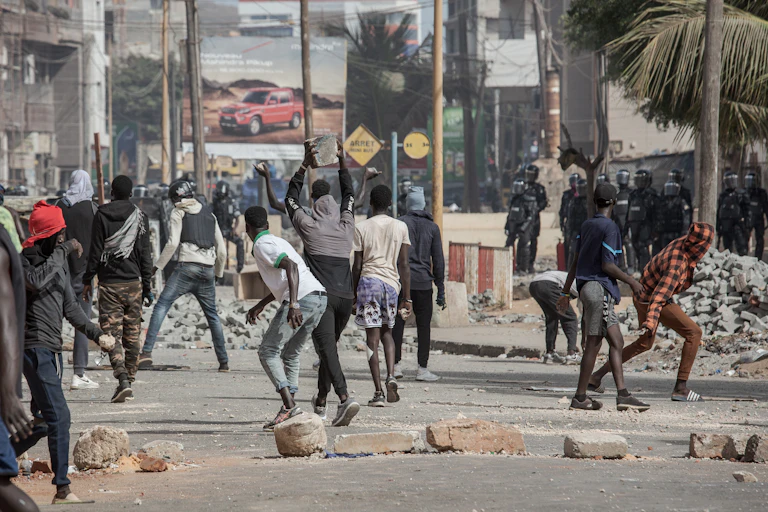 People throwing stones at the police