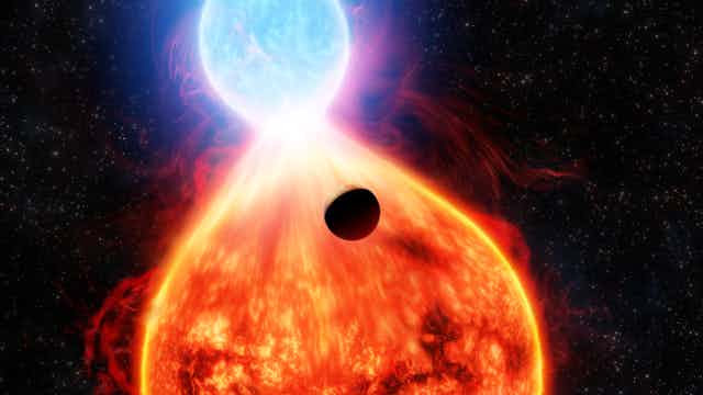 An illustration showing a dark planet near a red star and a blue-white star in the process of merging.