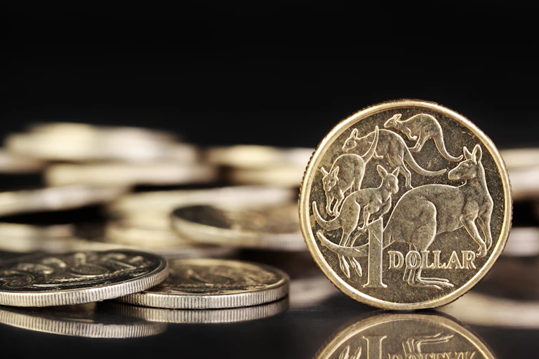 A $1 coin on a desk