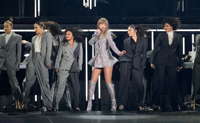 Taylor Swift, center, performs during the opener of her Eras tour on Friday, March 17, 2023, at State Farm Stadium in Glendale, Arizona