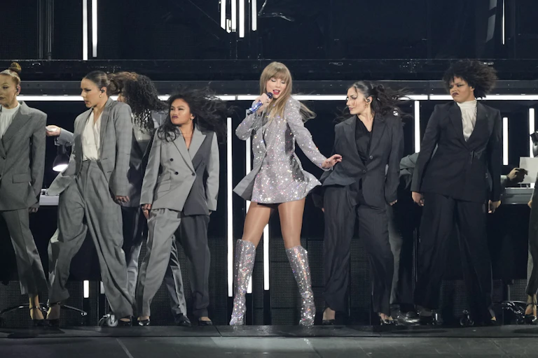 Taylor Swift, center, performs during the opener of her Eras tour on Friday, March 17, 2023, at State Farm Stadium in Glendale, Arizona