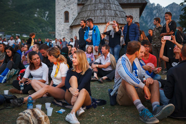 Young Albanians celebrate at a music festival.