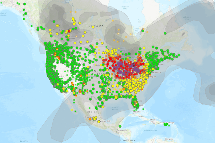 A map of North America shows wildfire smoke from fires in Alberta and Ontario, Canada, detected strongly with poor air quality in the Great Lakes region, Northeast and Midwestern U.S.