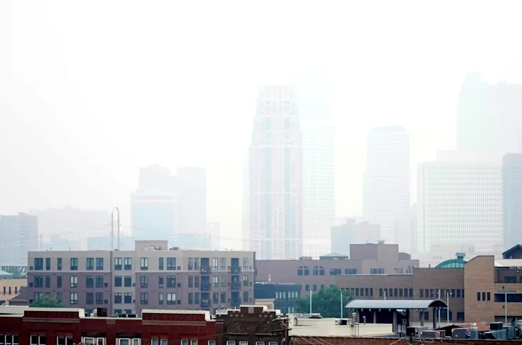The city skyline disappears as the viewer looks farther into the haze, which is coming from wildfire smoke.