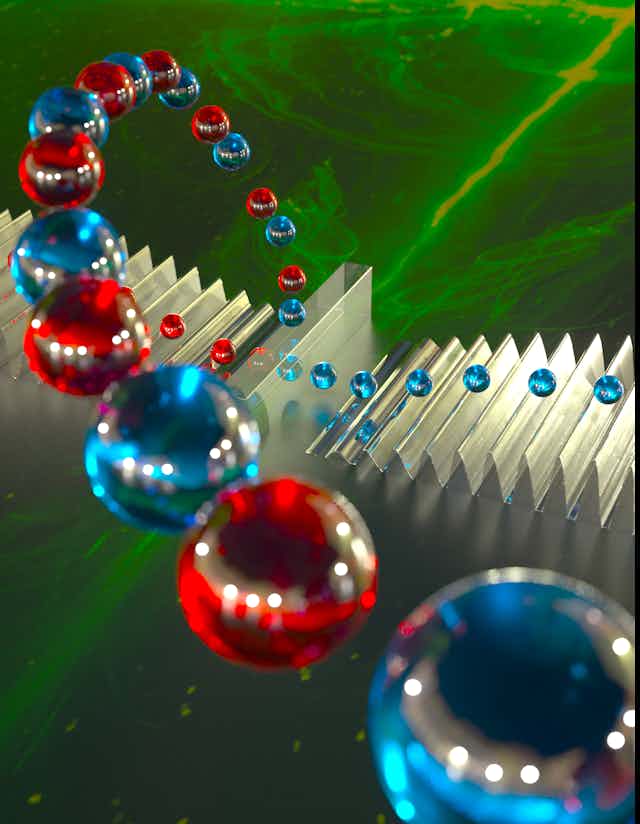 An illustrated stream of particles represented by red and blue orbs streaming from a shiny, mirror-like object