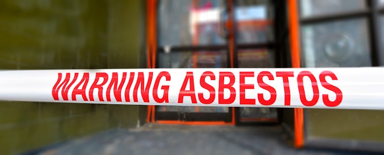 A sign warning of asbestos exposure