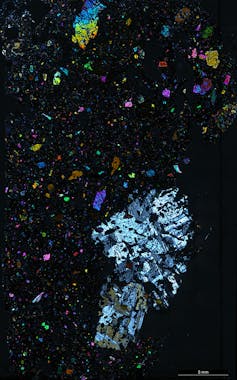 A black background with colourful crystals in it
