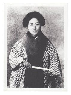 black and white photography of Qiu Jin in a large robe.