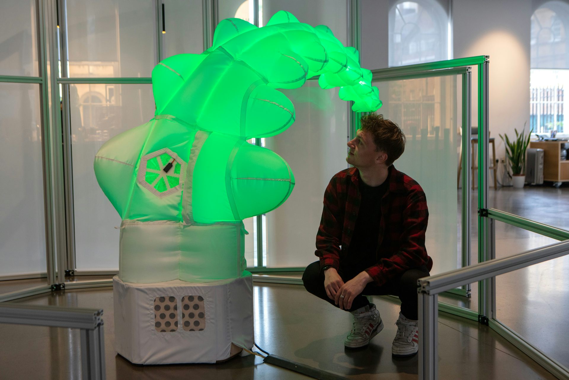 A green tentacle looking robot