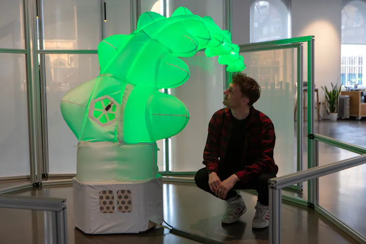 A green tentacle looking robot