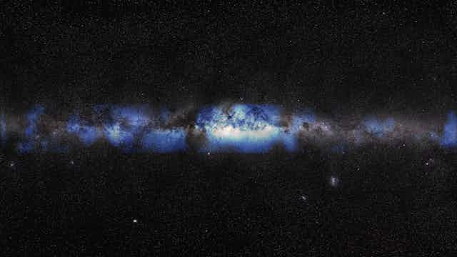 A blue-ish gray galaxy surrounded by black space and stars.