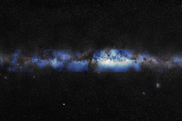 A blue-ish gray galaxy surrounded by black space and stars.