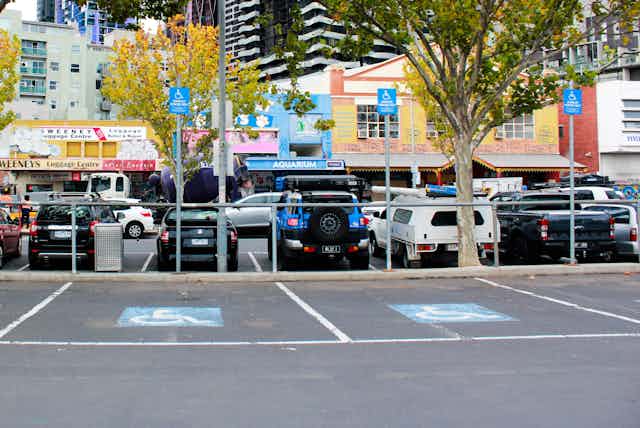 Line of vehicles parked in a city car park