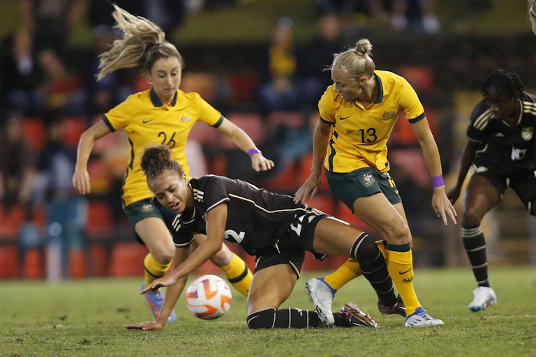 Women playing soccer