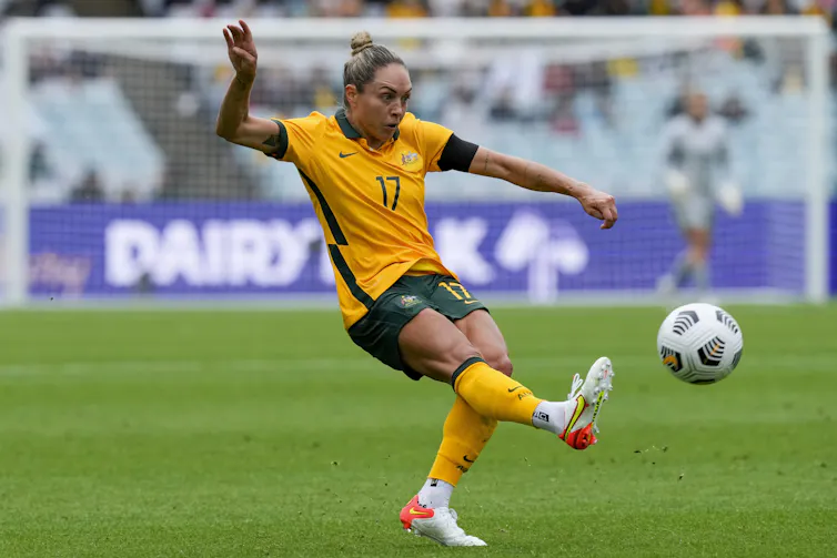 Woman kicking ball