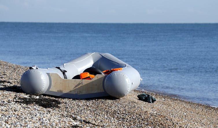 A small rubber dinghy on a beach in England