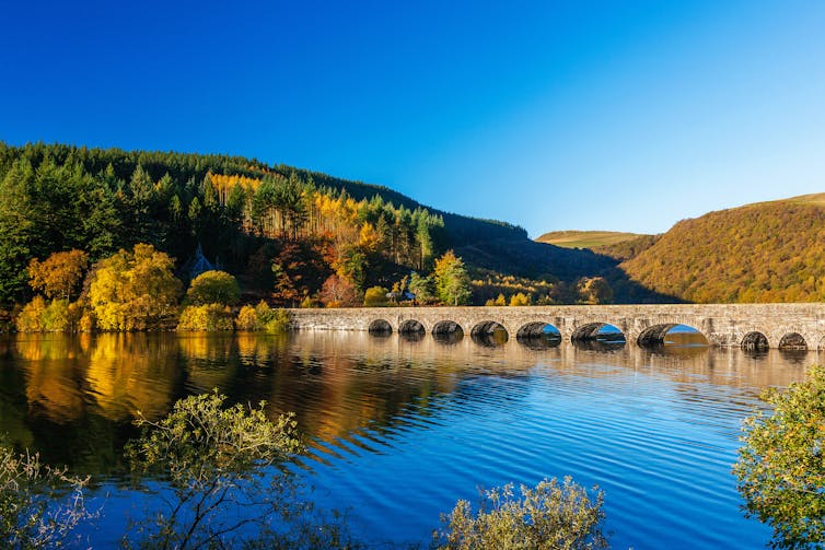 A reservoir surrounded by hills.